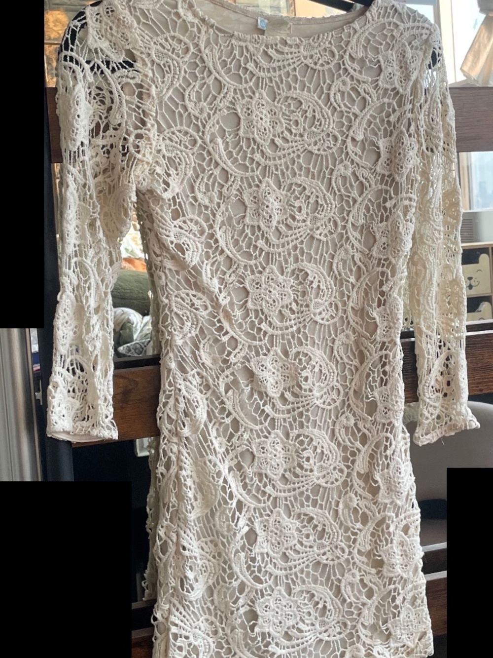 Cream long-sleeve lace bodycon dress with an intricate floral crochet overlay